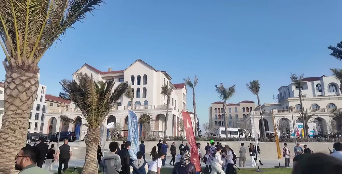 The Marina Village square with flags (a frame from a video of the channel “Evrey iz Baku”, May 2025)